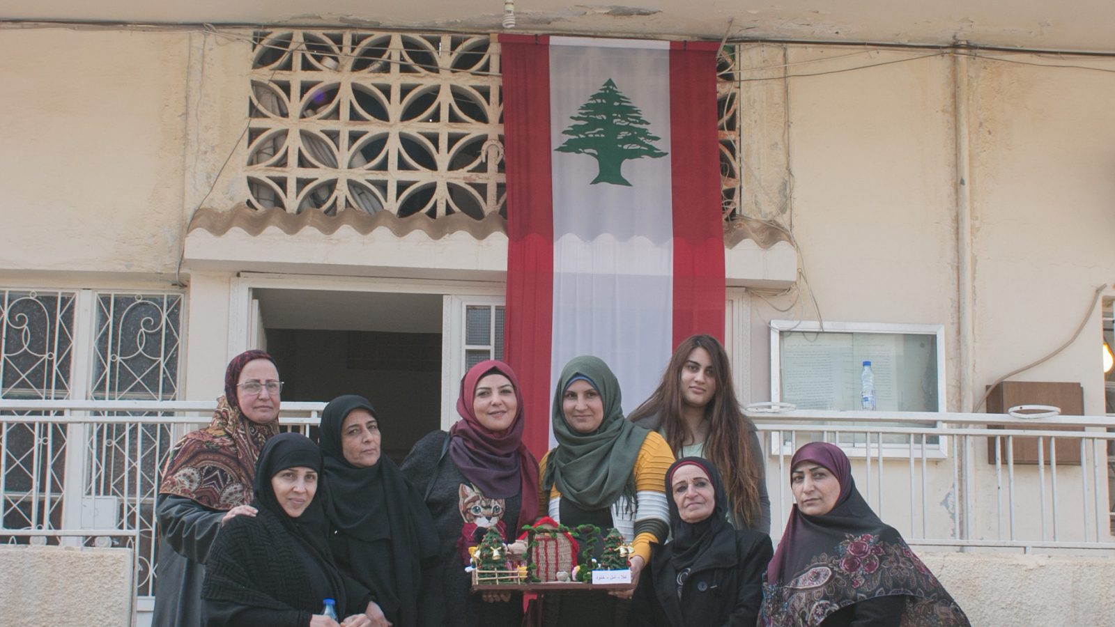 Souhayla and some of the participants of the EU-funded DAWRIC workshop pose with one of their creations in front of the municipality of Douris in Lebanon